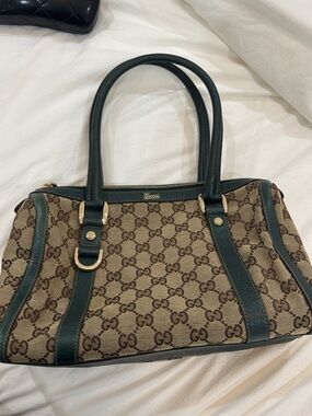 Gucci Small GG Canvas Abbey D-
Ring Boston Bag